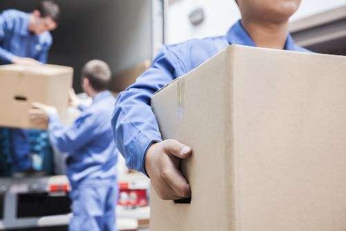 Removal team preparing a home move in Raynes Park