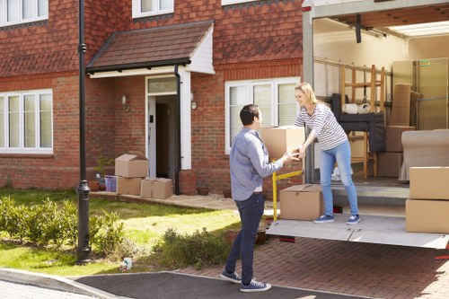 House removal team helping a family move in Raynes Park