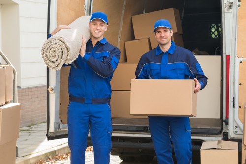 House movers helping a family move in Raynes Park
