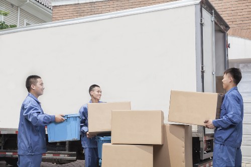 Man with van team preparing a safe move with careful lifting and planning