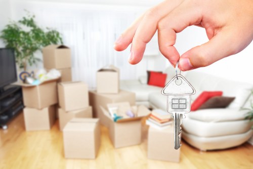 Moving van and packed boxes for a Raynes Park home removal