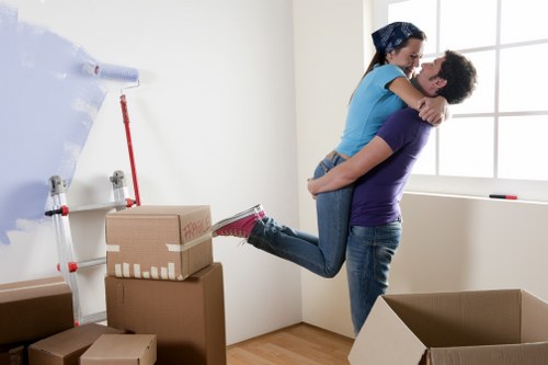Packed boxes and furniture prepared for a house move in Raynes Park