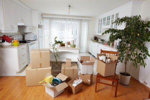 Unpacking boxes into a Raynes Park property after a move