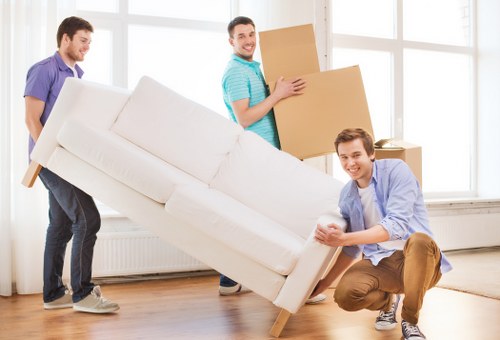 Business equipment and furniture being prepared for an office move in Raynes Park