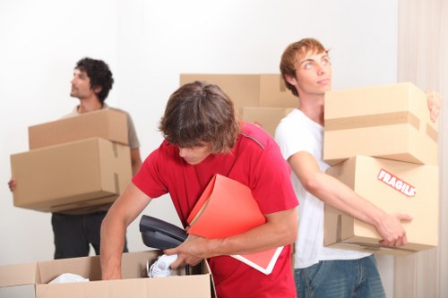 Raynes Park moving crew handling fragile items and packing support