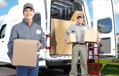 Household removal service handling furniture in Raynes Park