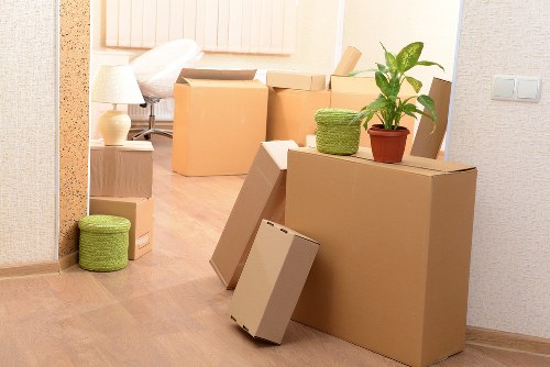 Movers loading business equipment for a commercial relocation