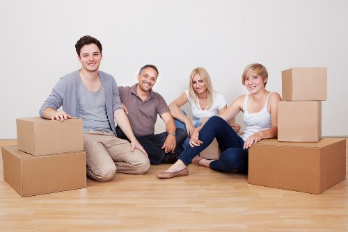 Office furniture and equipment being placed in a new workplace