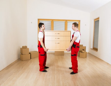 Raynes Park removals team handling boxes and household items