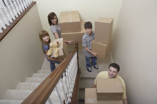 Furniture and household items being loaded for house removals in Raynes Park